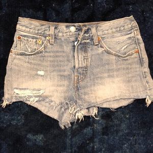 Medium wash high waisted Levi’s shorts.